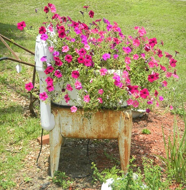Old washing machine re-purposed into a planter